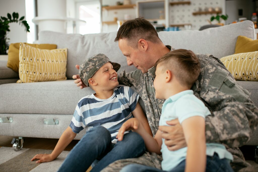 Veteran speaking with children at home while navigating VA disability claim process